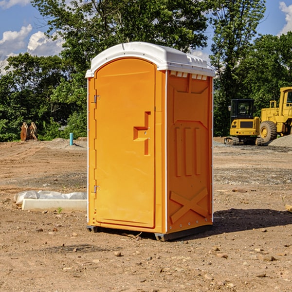 what is the cost difference between standard and deluxe portable restroom rentals in Buchanan County